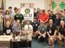 A College Amateur Radio Initiative contingent (and friends) attended HamCation. ARRL CEO Tom Gallagher, NY2RF, is in the front row, third from the left, kneeling. [Bob Inderbitzen, NQ1R, photo]